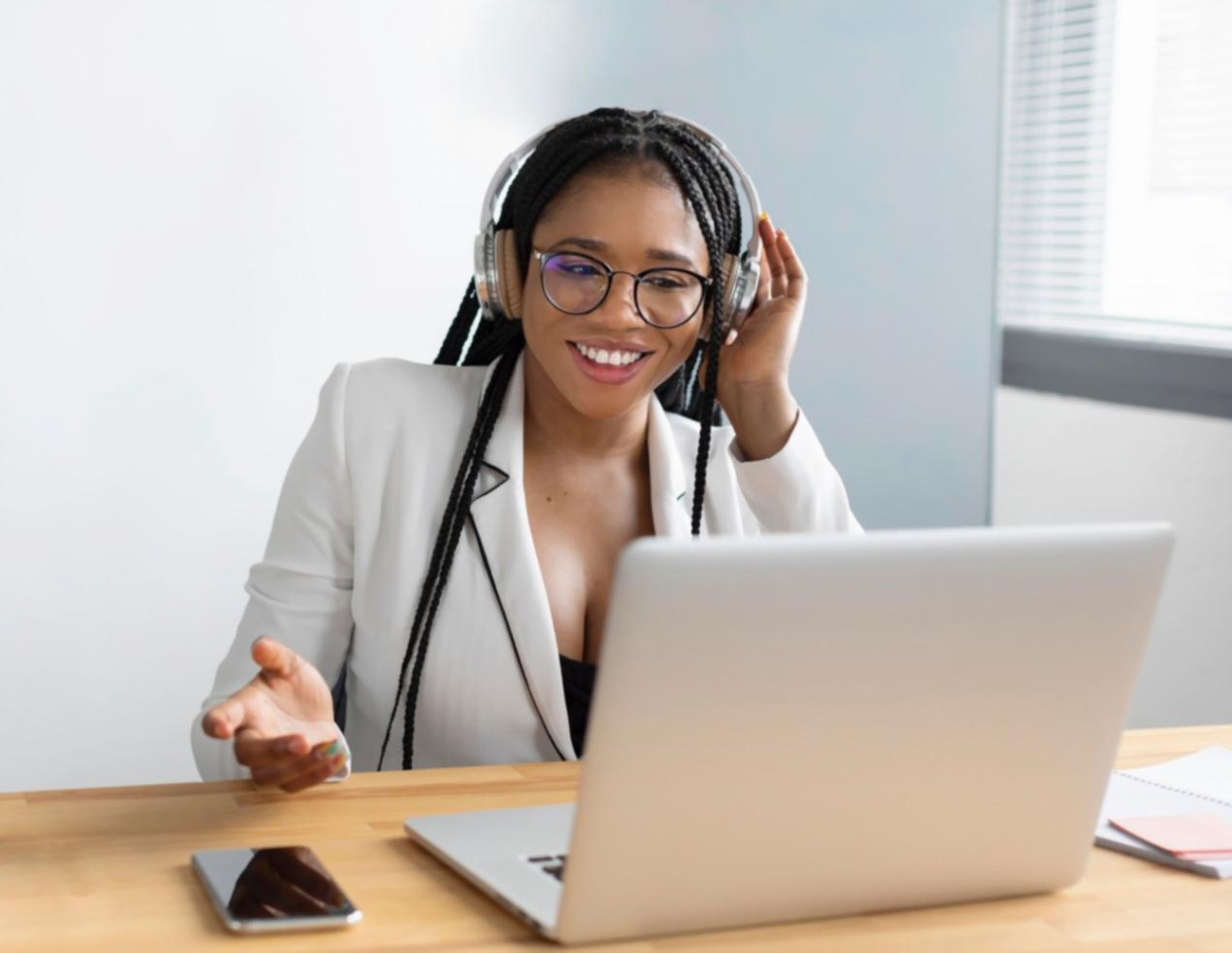 Students analyzing market data on multiple screens showing economic calendar events